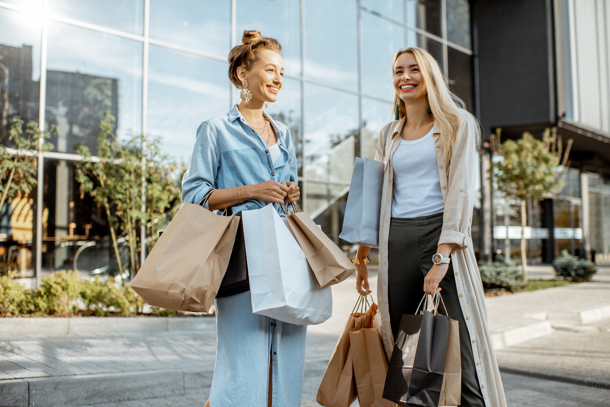 Women with shopping bags outdoors